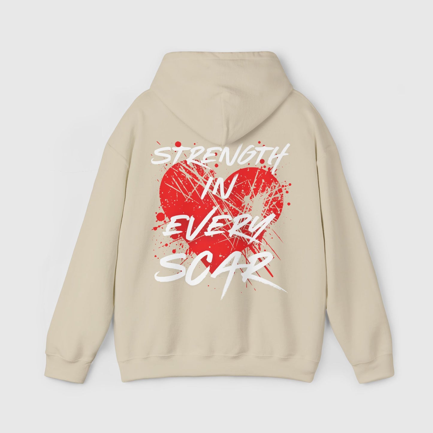 Beige men's hoodie featuring a bold 'Strength in Every Scar' design in white and red on the back, ideal for streetwear enthusiasts seeking an essential hoodie for fearless misfits.