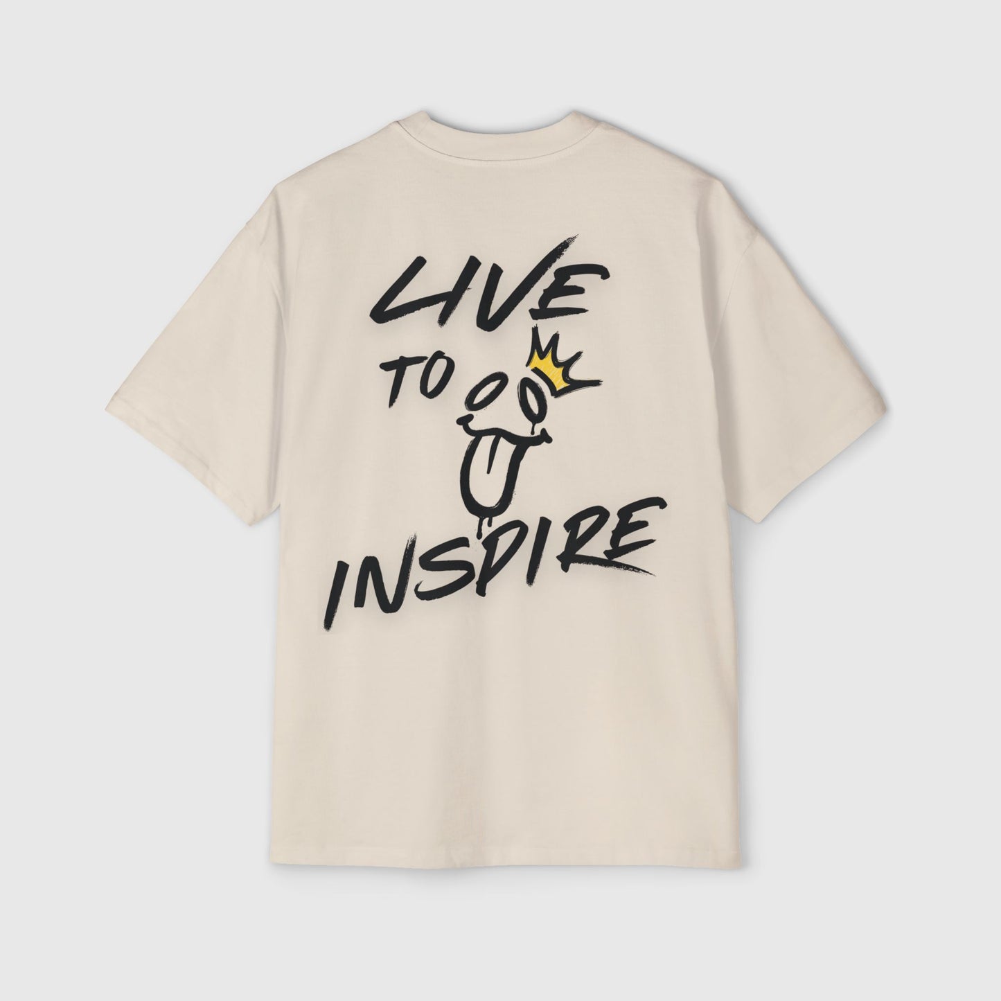 Sand-colored men's streetwear T-shirt showcasing graffiti-inspired 'Live to Inspire' text on the back with a quirky face and crown design. A stylish essential for gym and casual wear