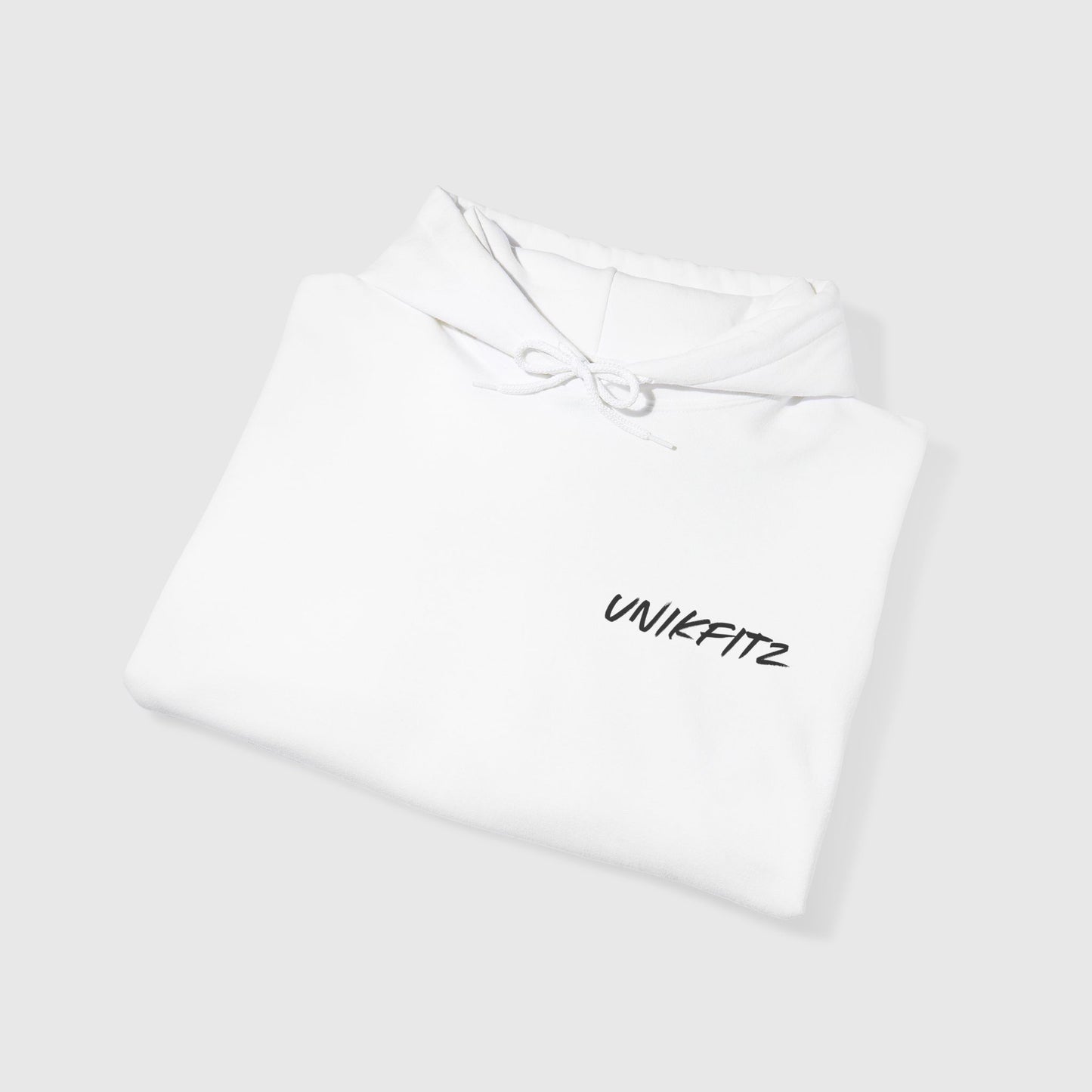 Close-up of the collar on a white men's hoodie, showcasing premium fabric and minimalist 'UNIKFITZ' branding. Perfect for streetwear, gym, and casual men's clothing styles