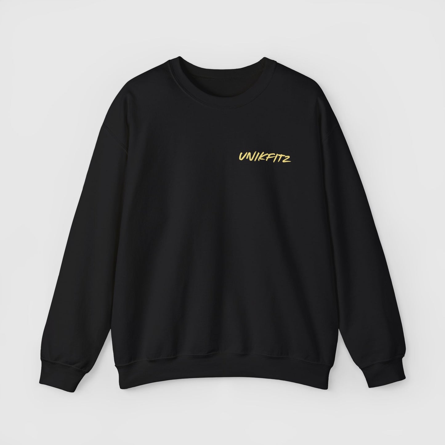 Front view of a sleek black sweatshirt with the iconic yellow 'UNIKFITZ' logo on the chest. A must-have essential sweatshirt for those who value streetwear and stylish men's wear.