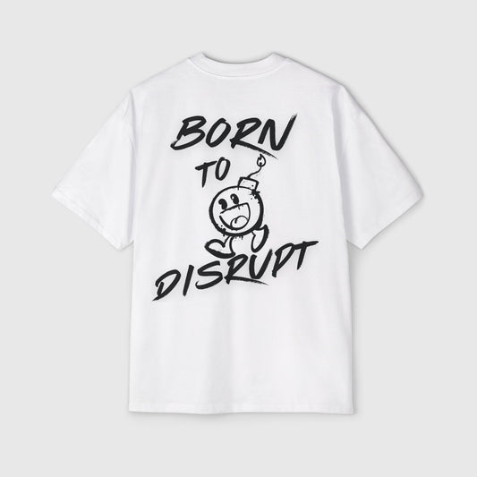 Men's white oversized t-shirt with bold 'Born to Disrupt' slogan and a cartoon bomb graphic in black, street wear-inspired design.