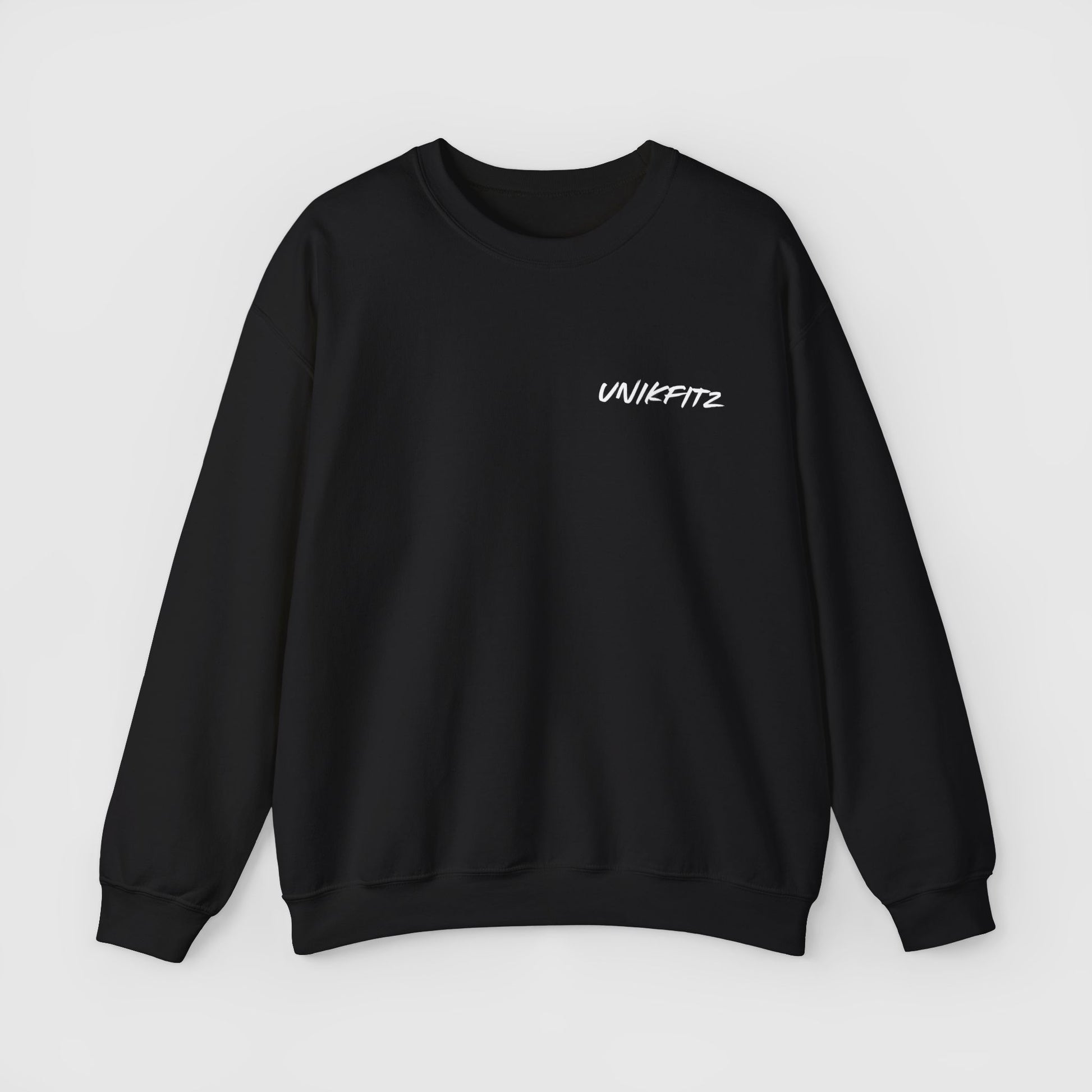 Minimalist black sweatshirt displaying the UNIKFITZ logo on the chest. An essential sweatshirt for streetwear enthusiasts, combining sleek design with versatility for gym or casual wear.