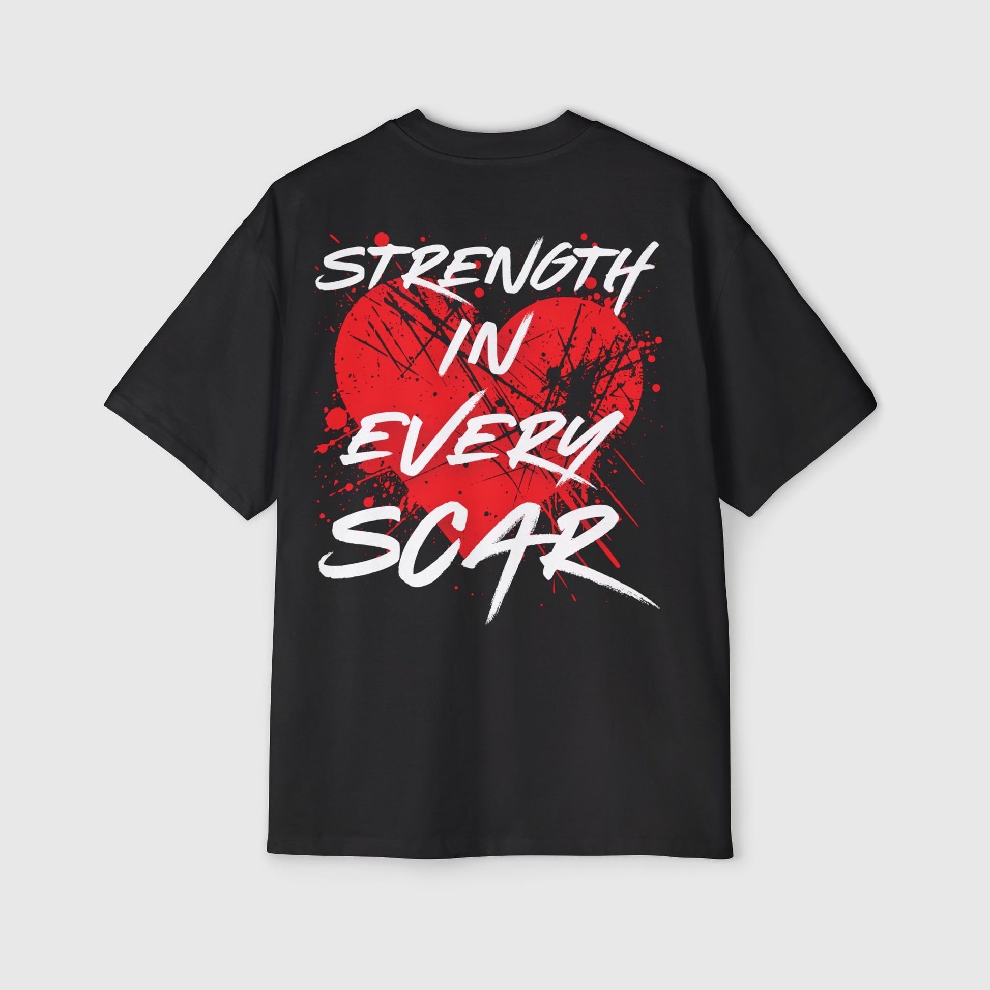 Back view of a men's t-shirt in black with a red graphic heart and "STRENGTH IN EVERY SCAR" print. A must-have street wear essential t-shirt for men