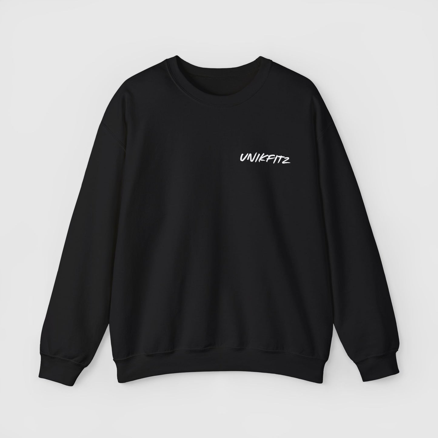 Front view of a black men's essential sweatshirt with 'Unikfitz' logo on the chest. Designed for streetwear and gym-ready men's clothing with a minimalist and modern aesthetic