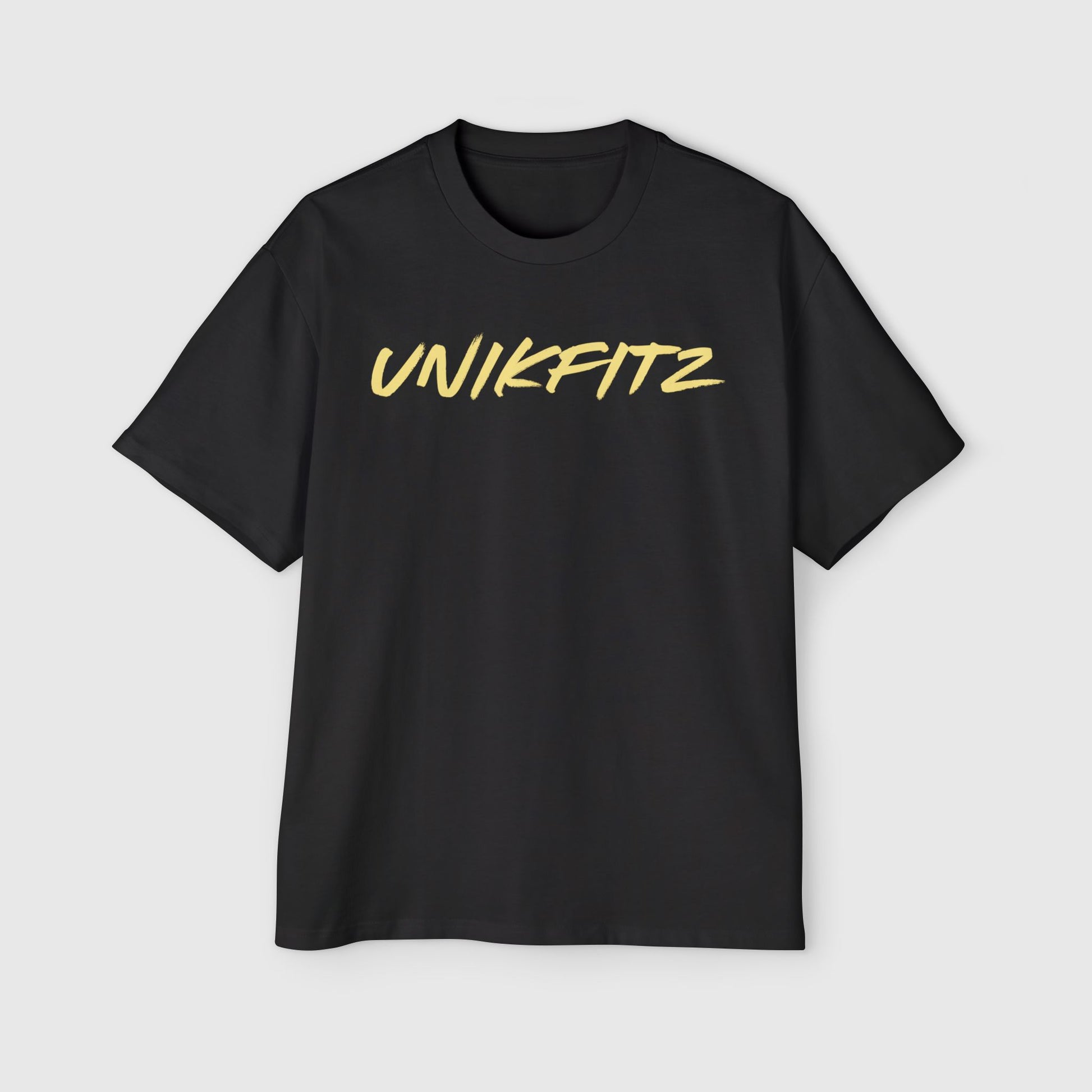 Front view of a black men's t-shirt by UNIKFITZ featuring a clean, modern yellow script logo. Perfect for casual street wear or essential men's gym clothing, this minimalist design combines style and versatility.