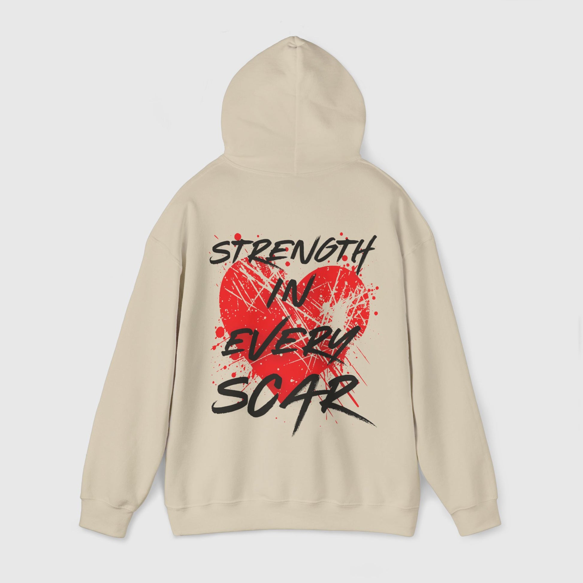 Back of a men's hoodie in beige with a bold red heart and 'Strength in Every Scar' graphic. Essential streetwear for fearless misfits embracing strength through their journey