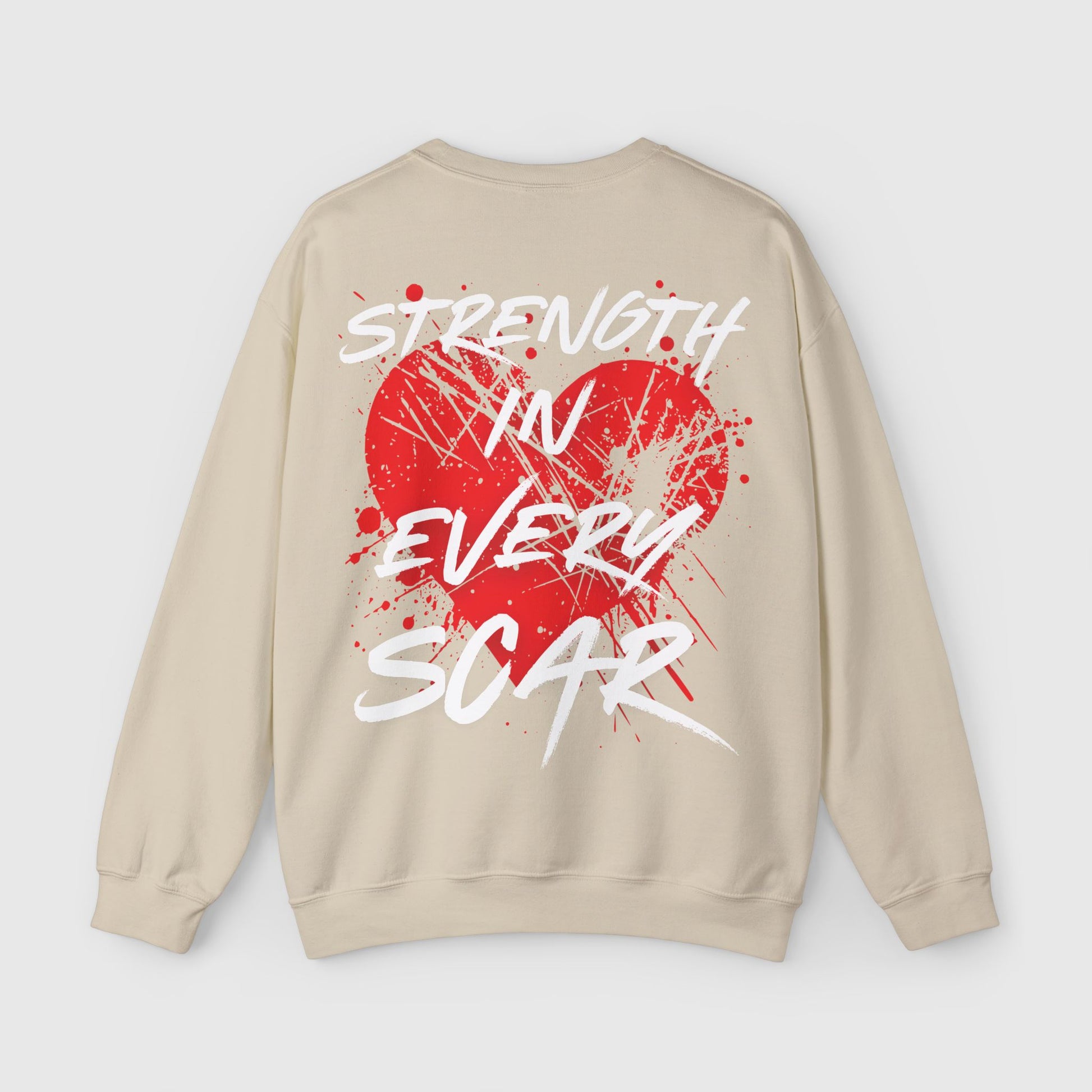 Back view of a beige men's sweatshirt with a bold red heart graphic and 'Strength in Every Scar' text in white. Ideal for street wear and a standout men's sweatshirt essential.