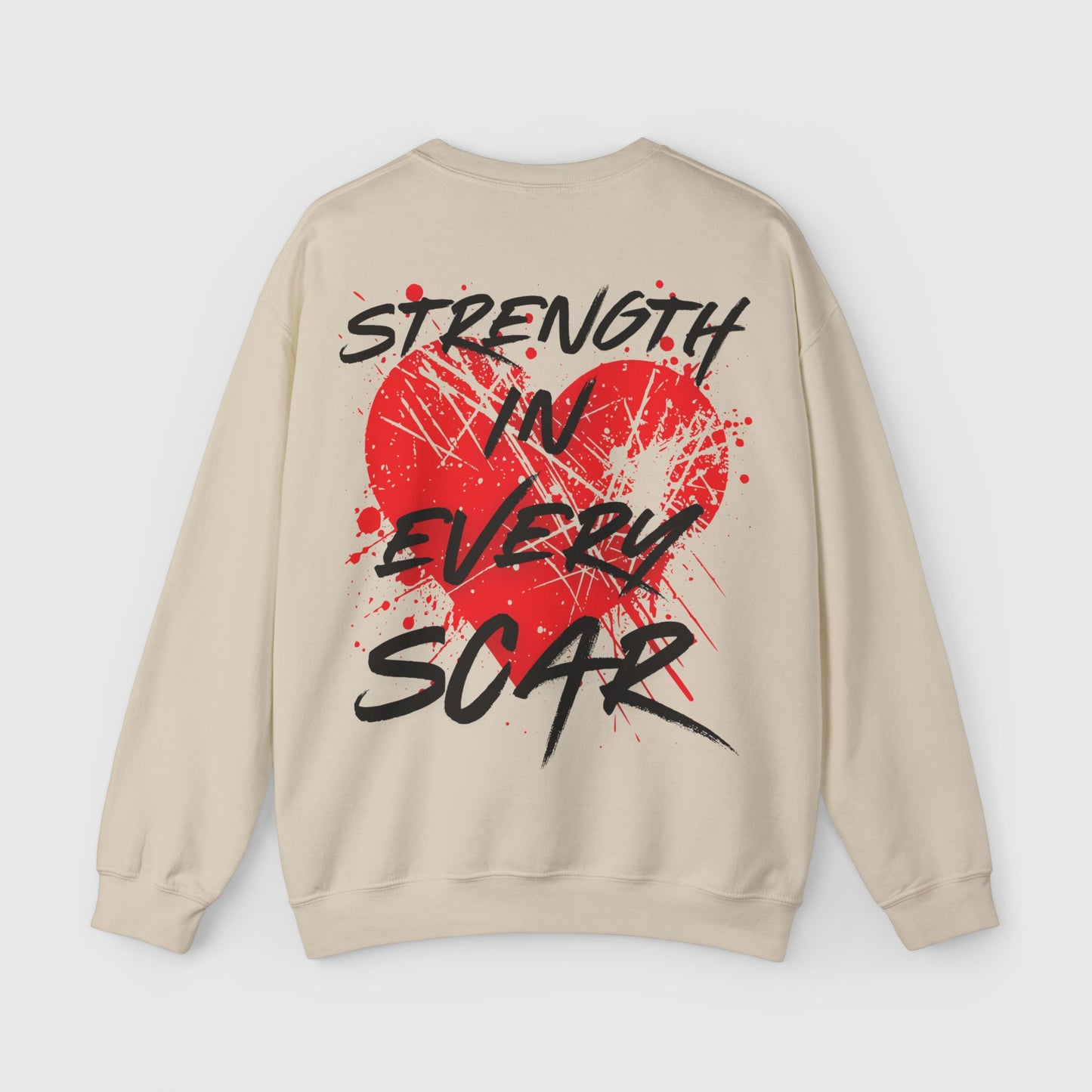 Beige sweatshirt with 'Strength in Every Scar' red heart graphic on the back, combining bold street wear designs with essential comfort for gym or casual men's clothing