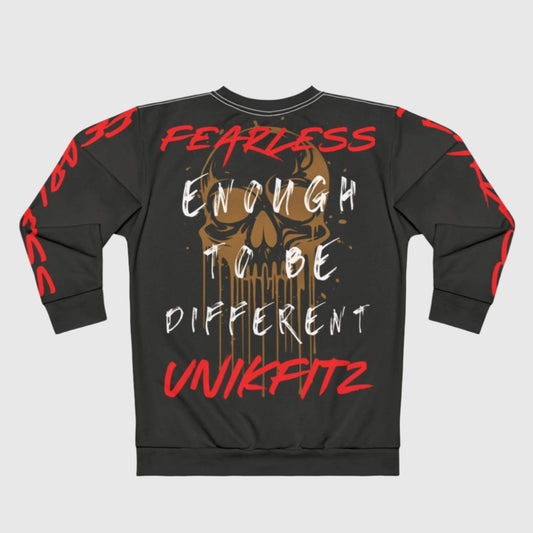 Back view of a charcoal gray men's sweatshirt showcasing a large dripping gold skull graphic with 'FEARLESS ENOUGH TO BE DIFFERENT' text in white and 'UNIKFITZ' in bold red graffiti font. Red 'FEARLESS' lettering runs down the sleeves for a statement street wear look. Ideal for gym or everyday wear