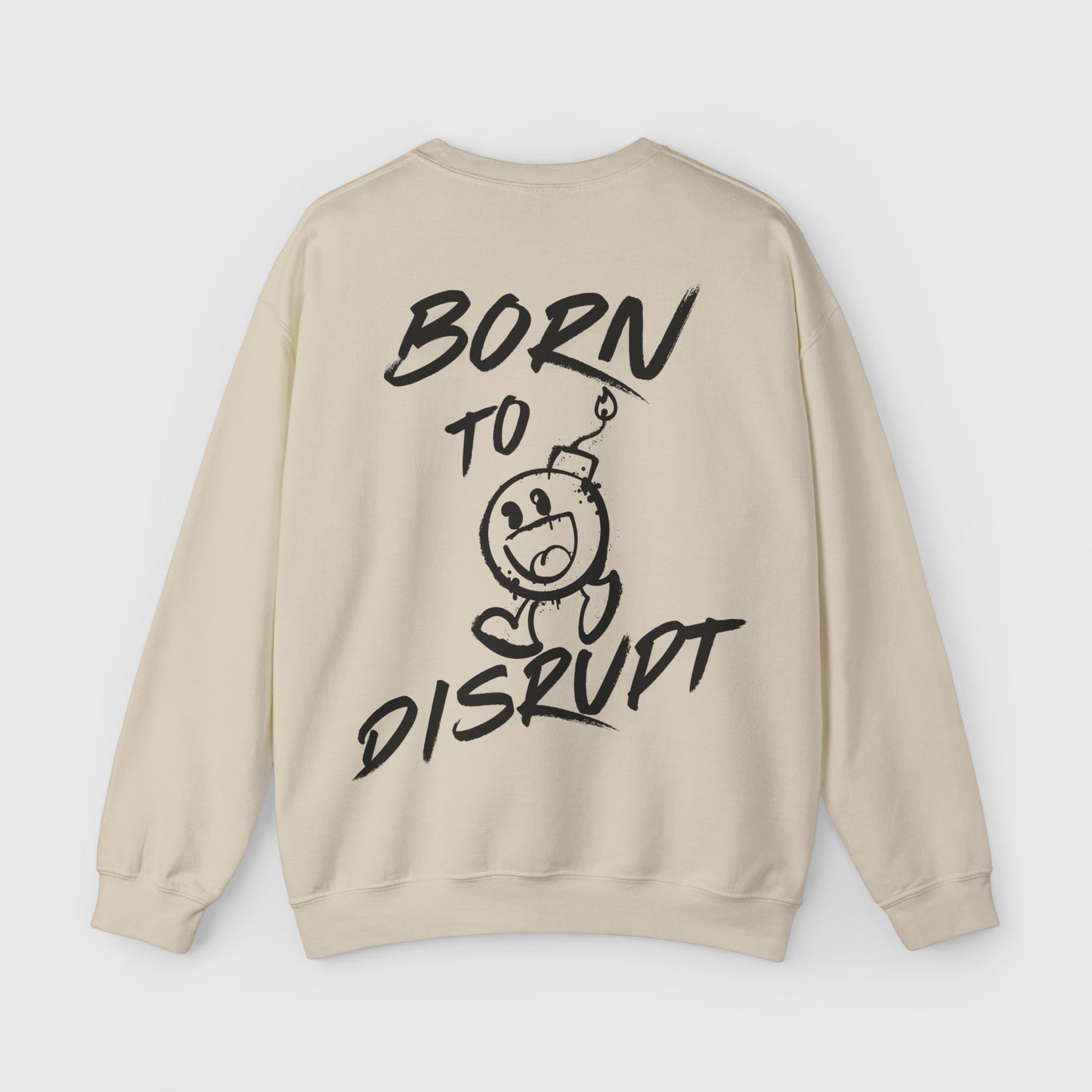 The back view of a beige men's sweatshirt showcasing a bold 'Born to Disrupt' graphic with a cartoon bomb illustration. Ideal for streetwear enthusiasts and those who embrace fearless fashion