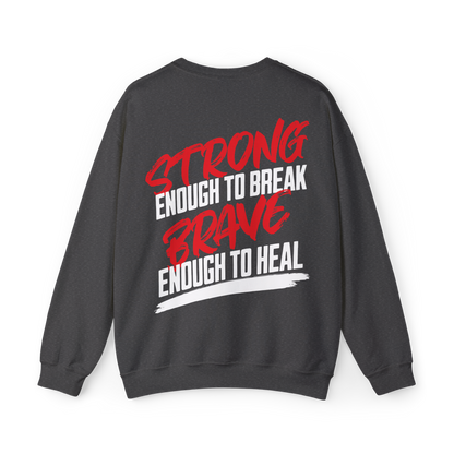 Back view of the Brave & Unbreakable Women's Sweatshirt in charcoal grey, featuring a bold typography design in red and white that reads 'Strong Enough to Break, Brave Enough to Heal.' This premium women's wear sweatshirt is a statement piece in Australian streetwear, ideal for gym wear, street fashion, and those who live with resilience