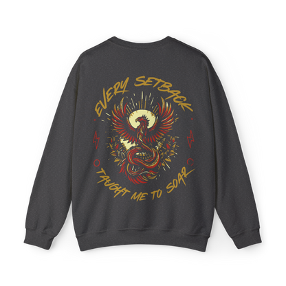 Back view of the Rise and Soar Women's Sweatshirt in charcoal grey, featuring a striking phoenix graphic in gold and red, with the phrase 'Every Setback Taught Me to Soar.' A bold statement piece in Australian streetwear, perfect for gym wear, women's clothing, and urban fashion.