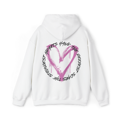 Back view of the Scarred Heart Women's white Hoodie with an eye-catching pink heart graphic and motivational quote. This Australian streetwear piece embodies strength and resilience, making it an essential t-shirt alternative for urban fashion lovers.