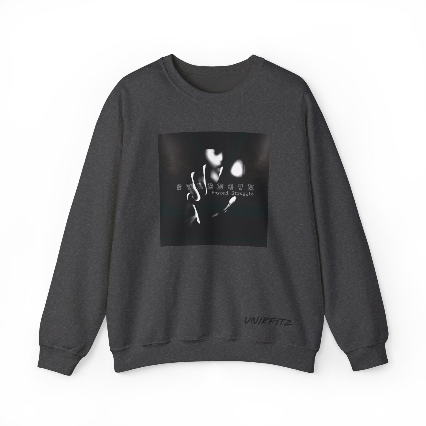 Front view of the Strength Beyond Women's Sweatshirt in charcoal grey by UNIKFITZ, featuring a striking black and white print with 'Strength Beyond Struggle' typography. A premium streetwear staple for women’s wear, ideal for gym sessions, urban fashion, and casual layering.
