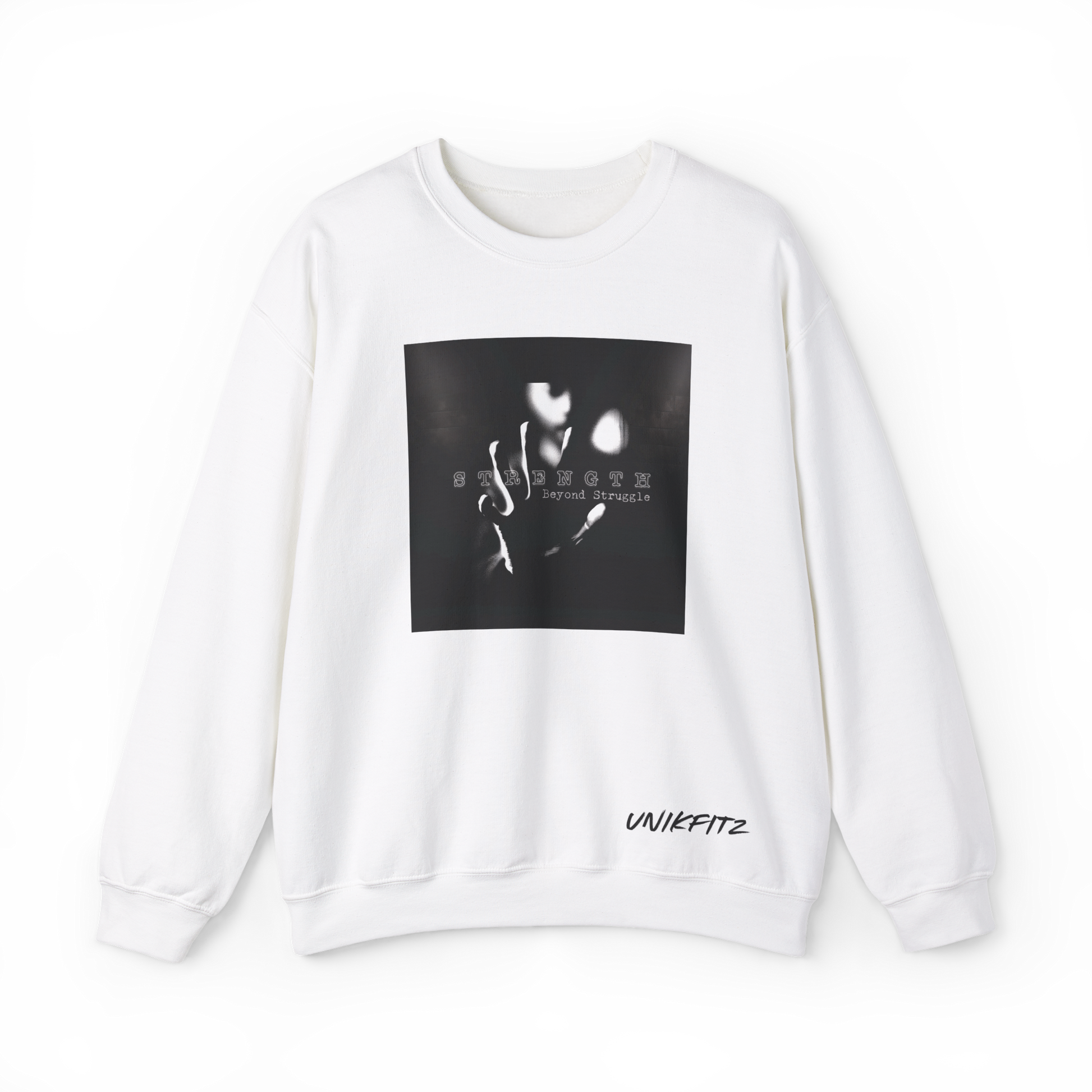 Front view of the Strength Beyond Women's Sweatshirt in white by UNIKFITZ, featuring a striking black and white print with 'Strength Beyond Struggle' typography. A premium streetwear staple for women’s wear, ideal for gym sessions, urban fashion, and casual layering.