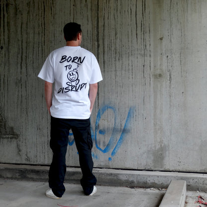 Back view of a model in the 'Born to Disrupt' oversized white t-shirt, showcasing rebellious typography and bold cartoon bomb artwork. Crafted for streetwear enthusiasts, gym lovers, and those who embrace disruption, this men's t-shirt essential is a statement piece in modern Australian streetwear.