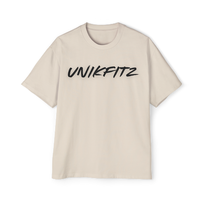 Born to Disrupt oversized t-shirt in beige, featuring a bold 'UNIKFITZ' logo on the front. This premium Australian streetwear women's clothing piece is crafted from heavyweight cotton for a structured fit, making it a women’s t-shirt essential for streetwear lovers and gym enthusiasts