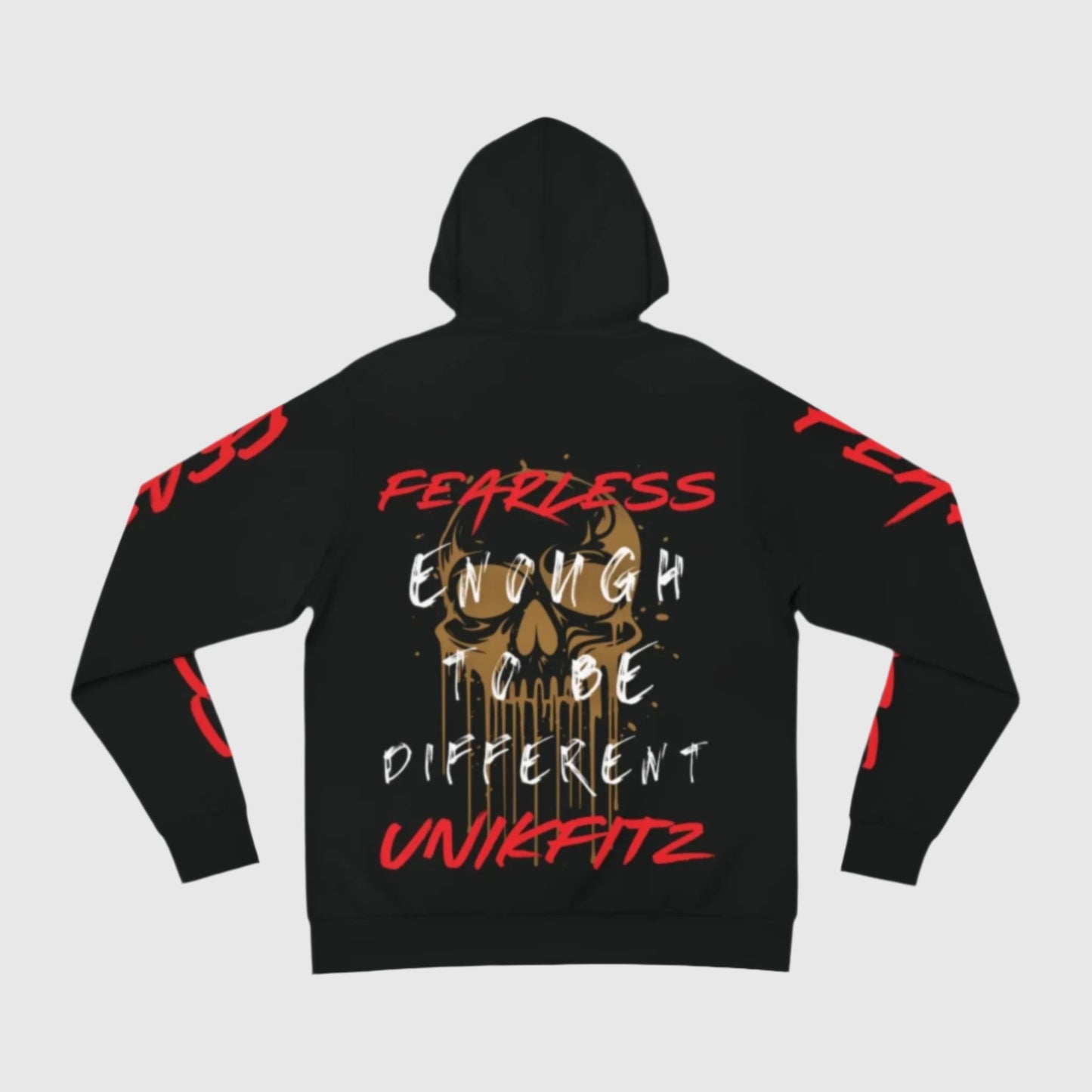 Rear view of a black men's hoodie showcasing a golden skull graphic with the text 'Fearless enough to be different' in bold white and red accents. A top choice for street wear, hoodie essentials, and the best hooded sweatshirt for men