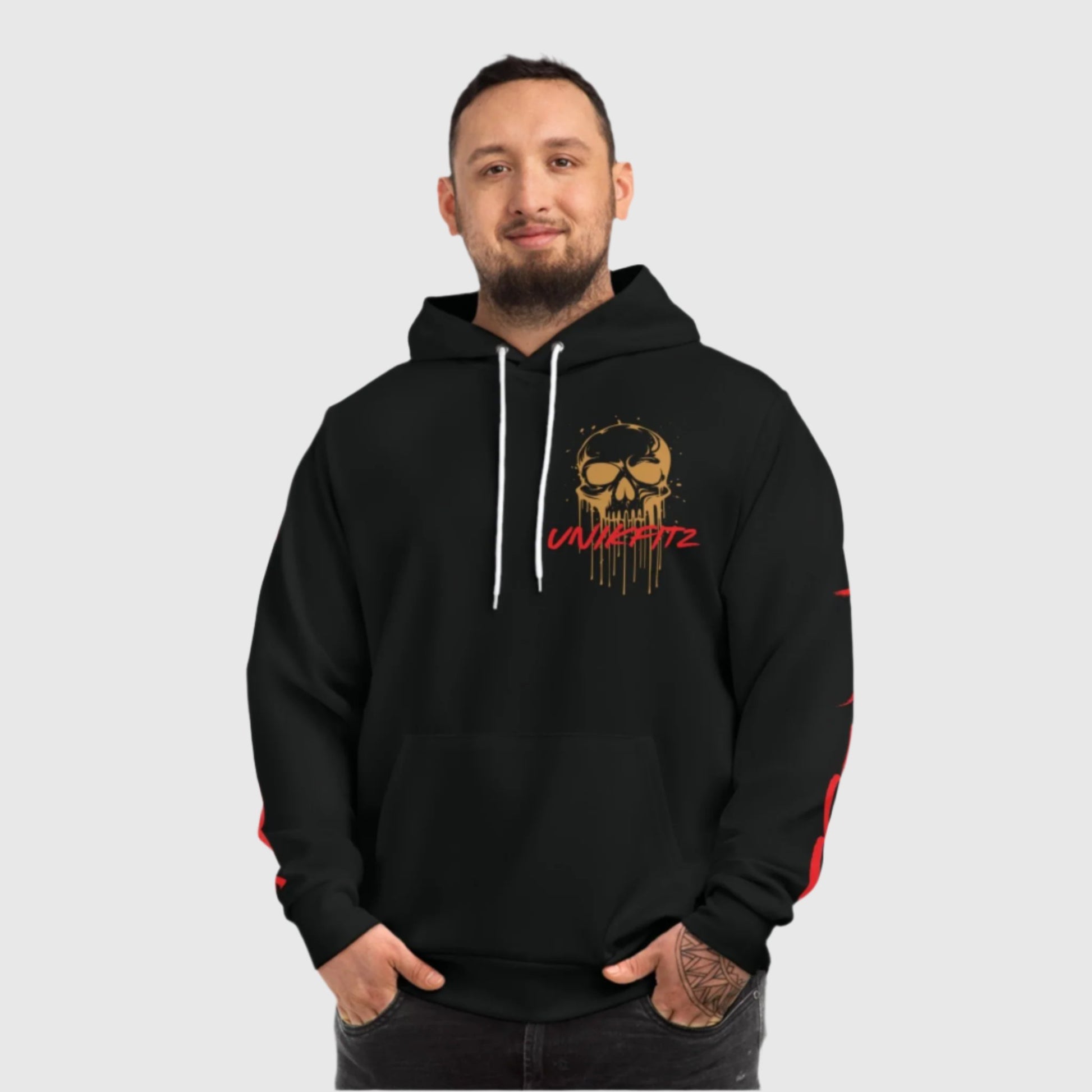 Front view of a black hooded sweatshirt featuring a bold skull design in gold with dripping details and the text 'Unikfitz' in vibrant red. Ideal for men's clothing enthusiasts, this street wear hoodie combines edgy style with comfort, making it one of the best hooded sweatshirts for men