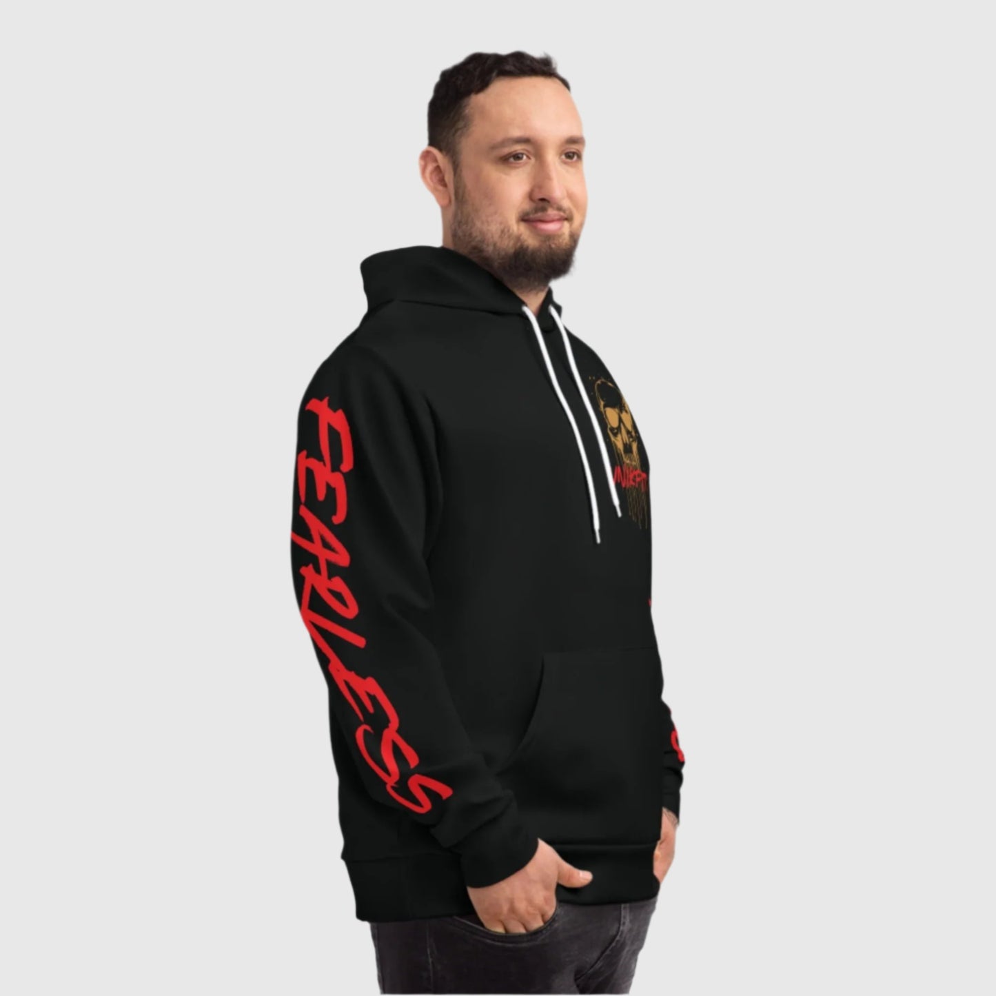 Side view of a man modeling a black 'Unikfitz' hoodie with bold red 'Fearless' text running down the sleeve. The perfect blend of street wear and gym-ready men's clothing